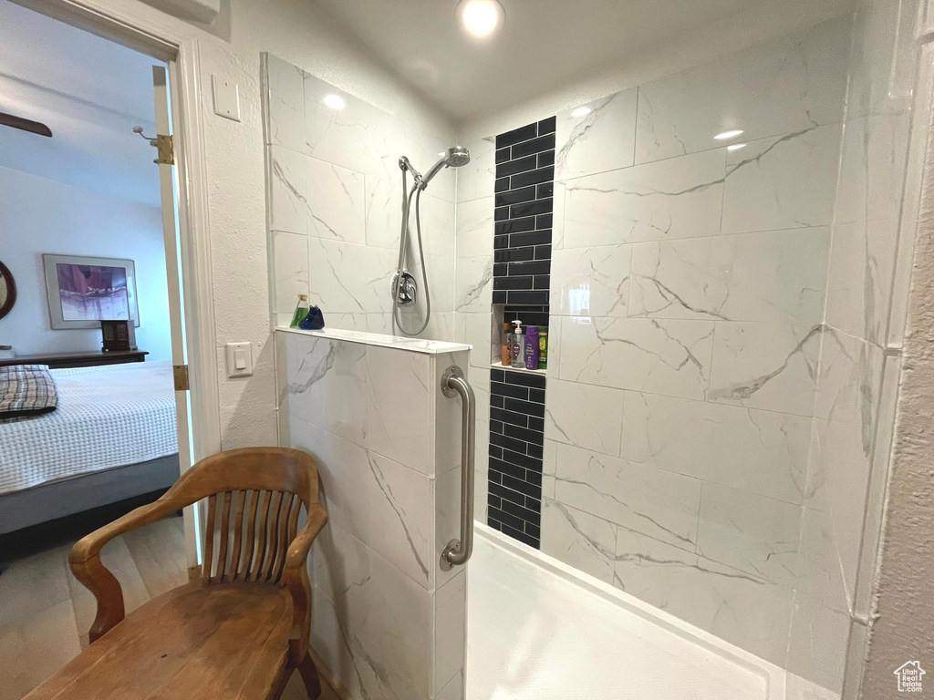 Full bath featuring ensuite bathroom and a tile shower
