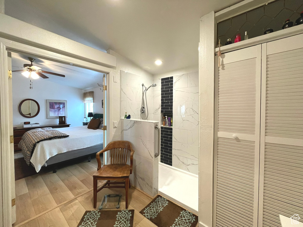 Bedroom featuring vaulted ceiling, light wood finished floors, and recessed lighting