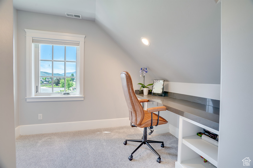 Office featuring lofted ceiling, carpet, and baseboards