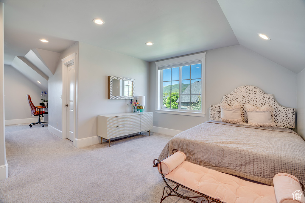 Bedroom with light carpet, recessed lighting, lofted ceiling, and baseboards