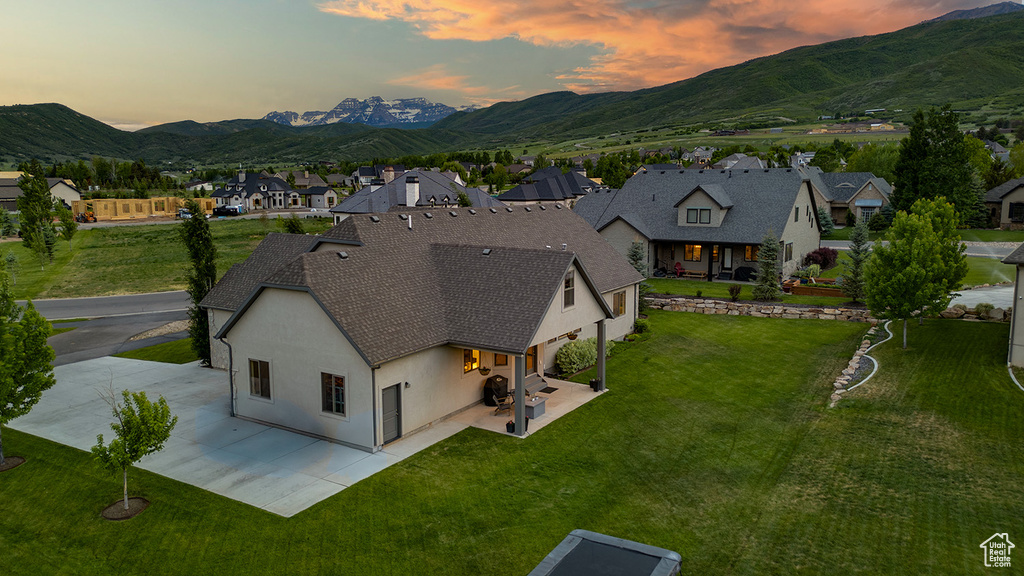 Aerial perspective of suburban area with a mountainous background