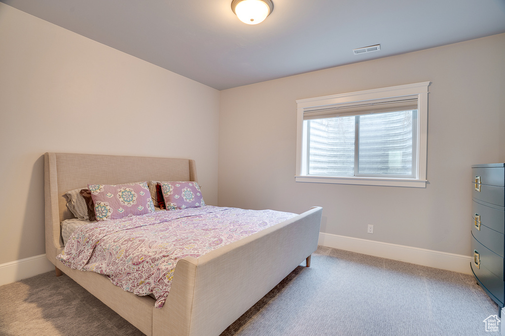Bedroom with carpet and baseboards
