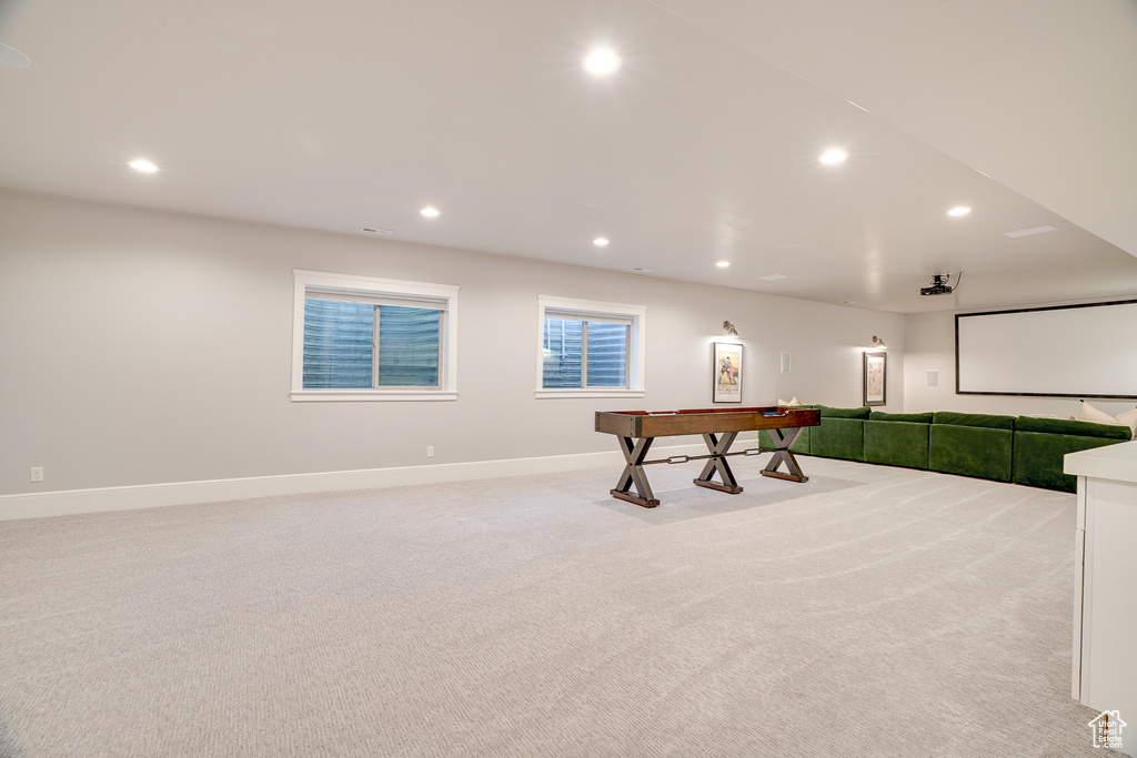 Rec room featuring light colored carpet, recessed lighting, and baseboards