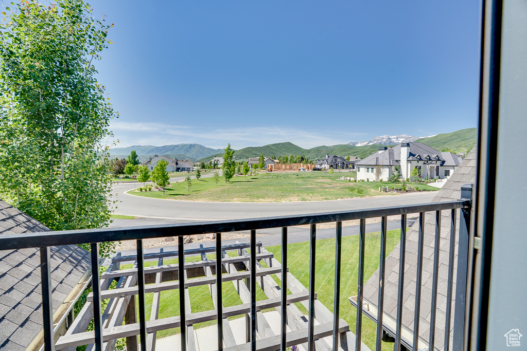 Balcony featuring a mountain view and a residential view