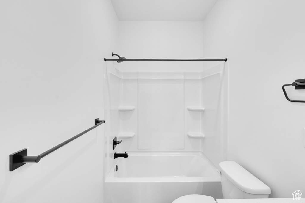 Full bathroom with toilet and tub / shower combination