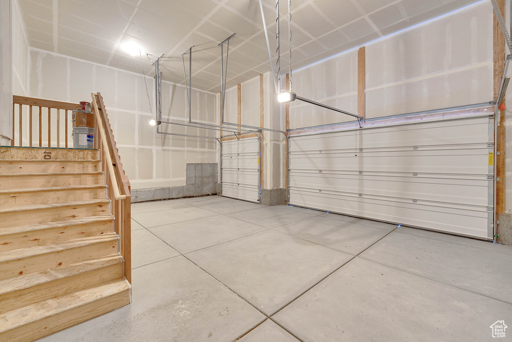 Garage featuring a garage door opener