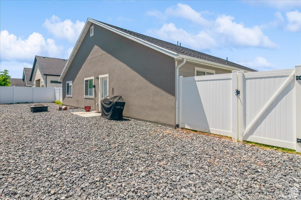 View of home's exterior with a gate and a fenced backyard