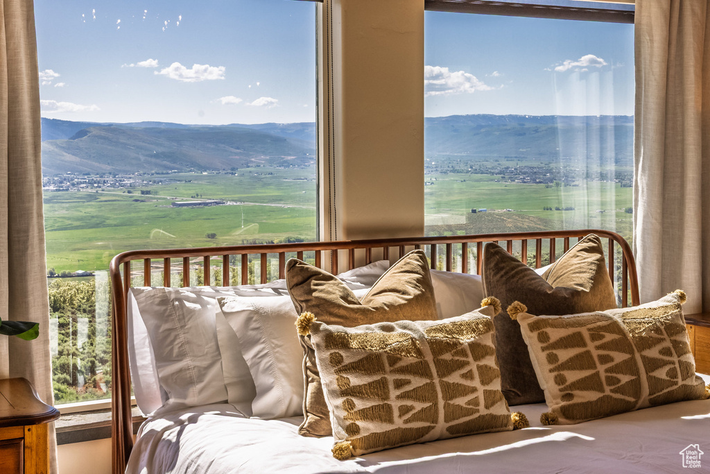 Balcony featuring a mountain view and a rural view