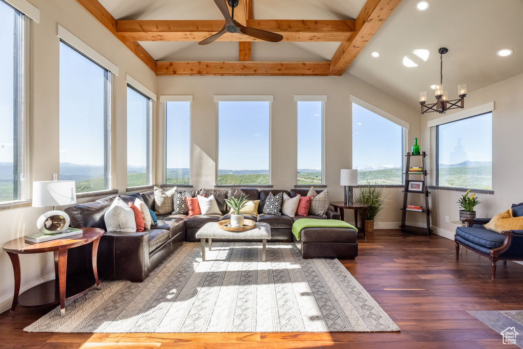 Sunroom / solarium with healthy amount of natural light, wood finished floors, recessed lighting, and a chandelier