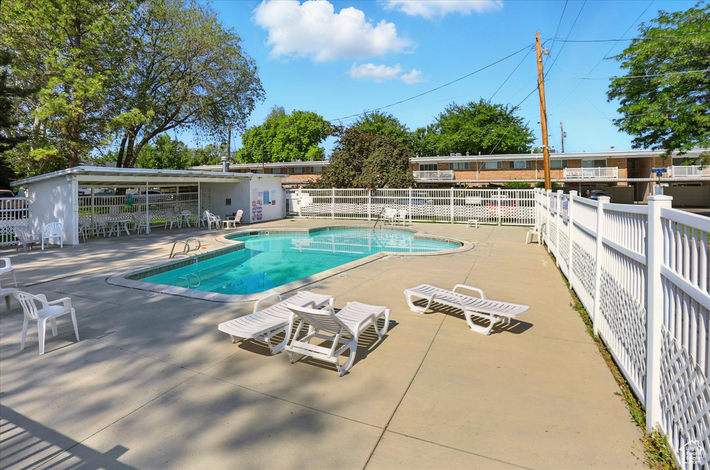 Community pool with a patio area