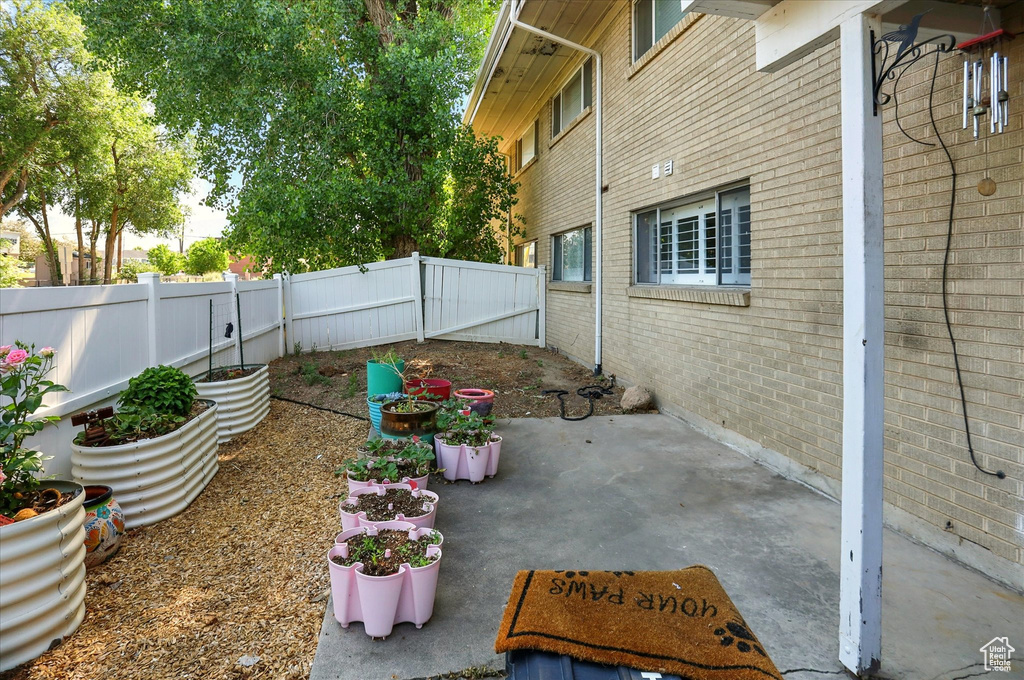 Fenced backyard featuring a patio