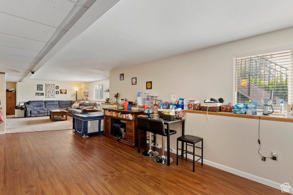 Bar featuring wood finished floors and baseboards