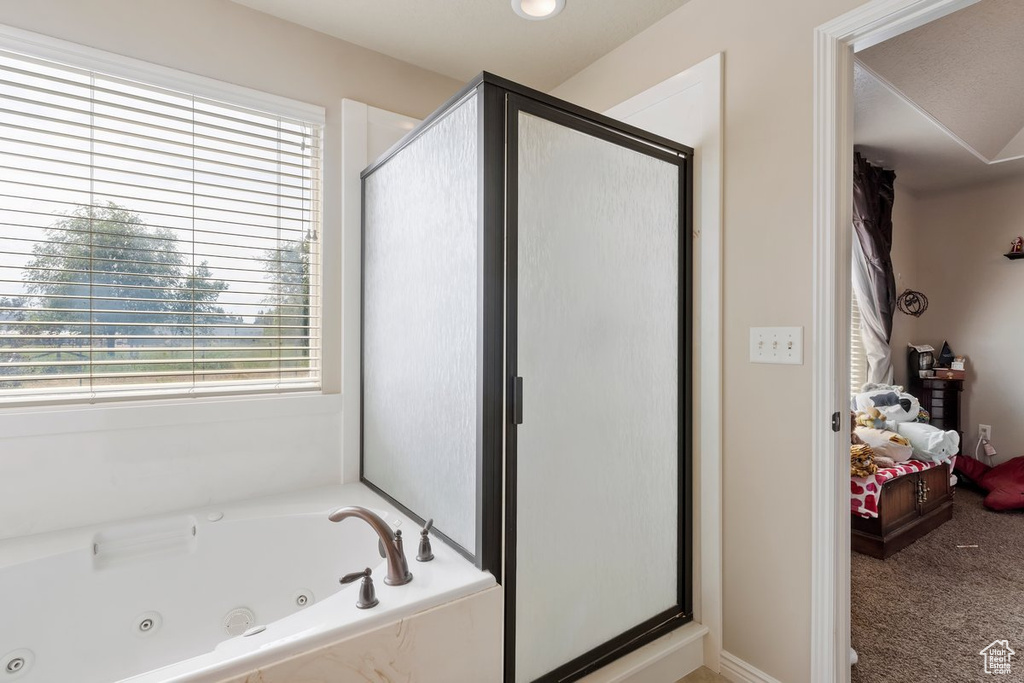 Ensuite bathroom with a shower stall and a jetted tub