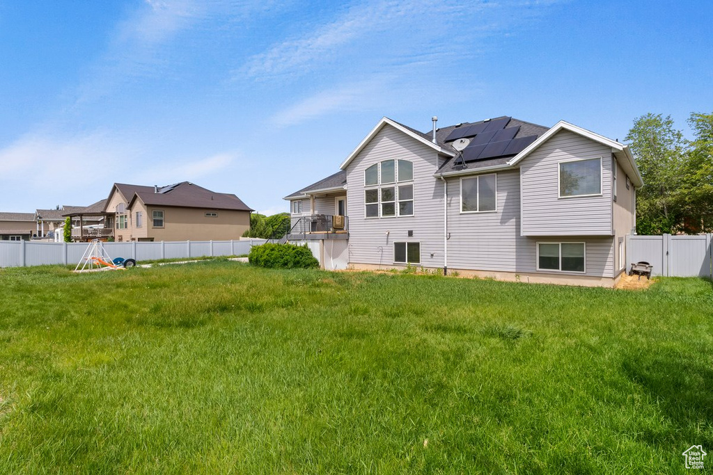 Back of property with roof mounted solar panels