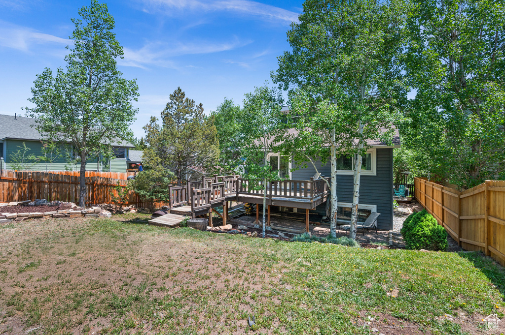 View of yard with a deck