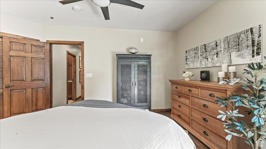 Bedroom with ceiling fan and baseboards
