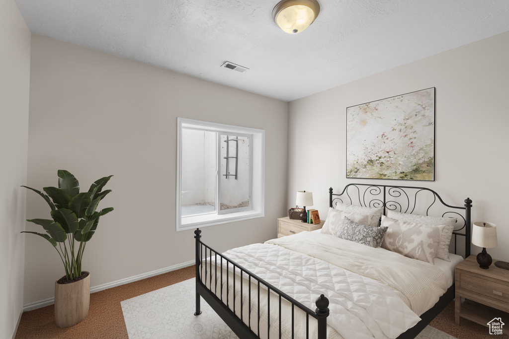 Bedroom with carpet and baseboards