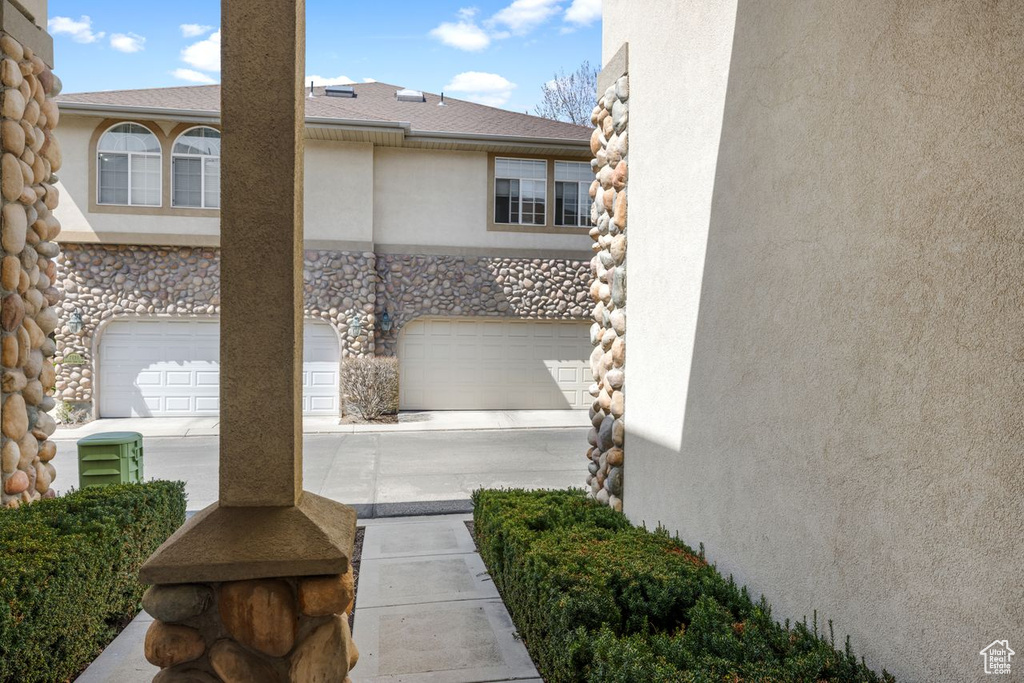 Exterior space with an attached garage and driveway