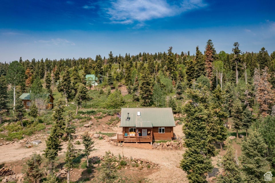 View from above of property with a forest
