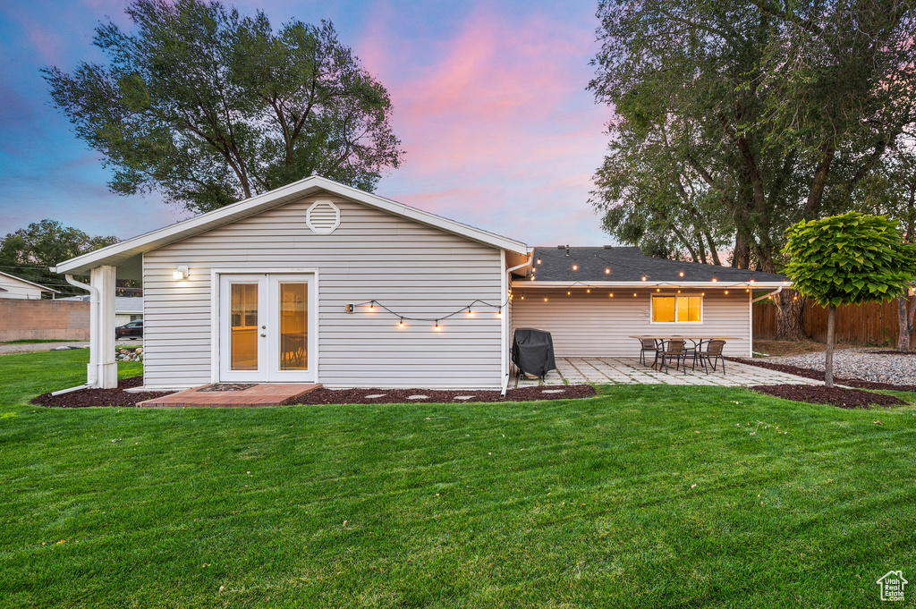 Rear view of property featuring a patio