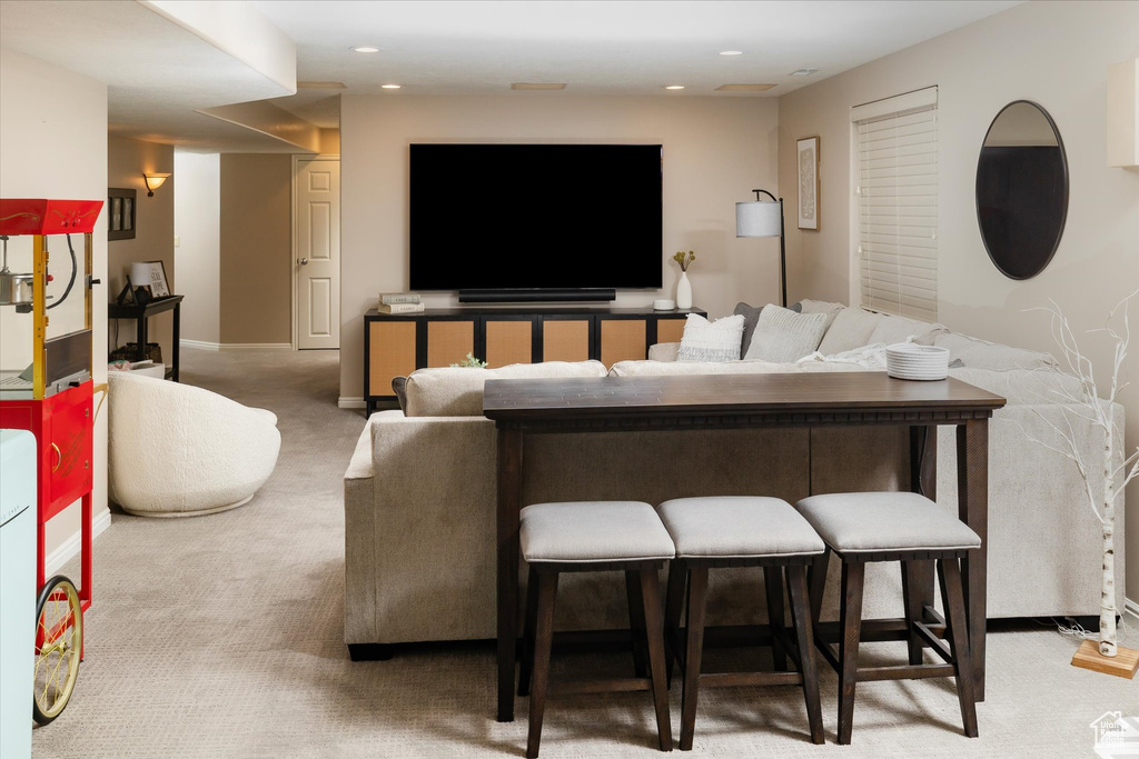 Living room featuring carpet and recessed lighting