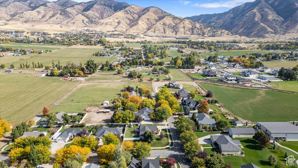 Aerial view of property\'s location featuring nearby suburban area and a mountain backdrop