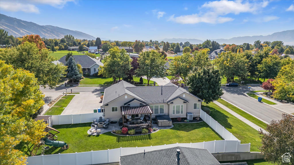 Aerial perspective of suburban area featuring a mountainous background