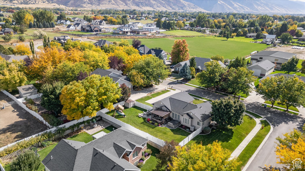 Aerial view of residential area featuring a mountain backdrop