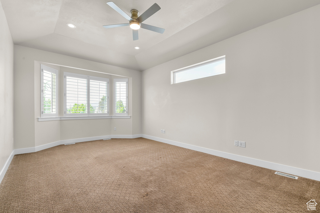 Carpeted empty room with healthy amount of natural light, ceiling fan, baseboards, and recessed lighting