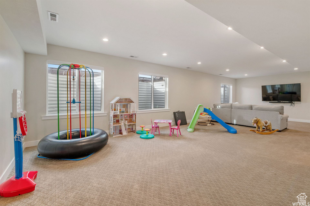 Playroom featuring carpet floors, baseboards, and recessed lighting