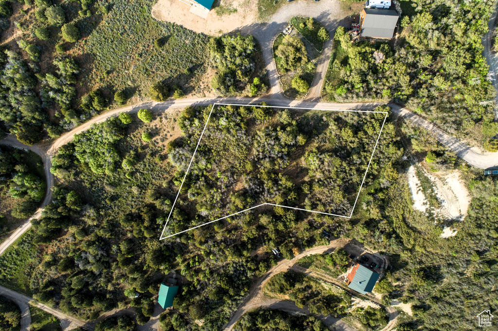 Aerial view of property and surrounding area featuring property parcel outlined