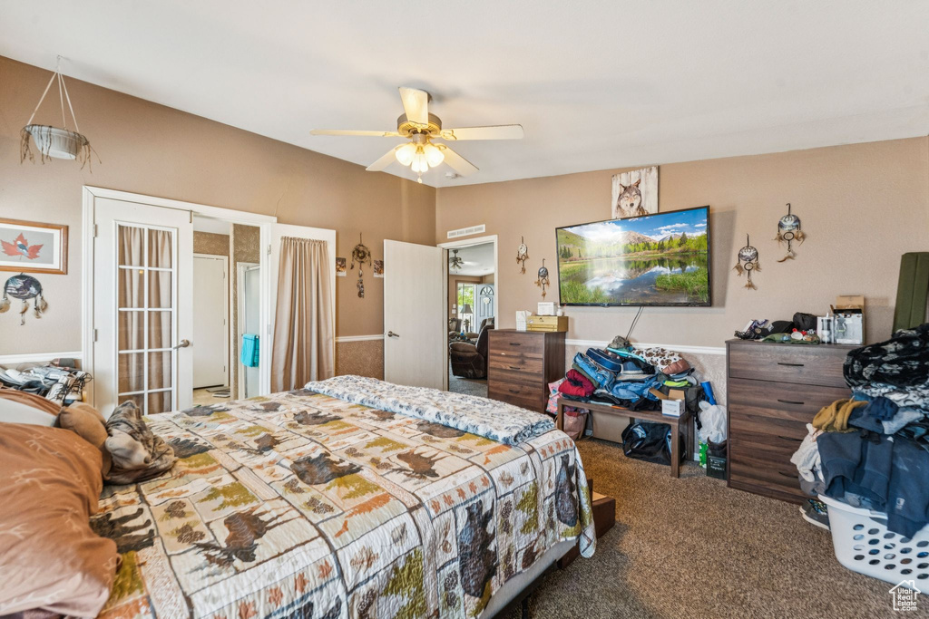 Bedroom featuring carpet flooring, ceiling fan, and french doors