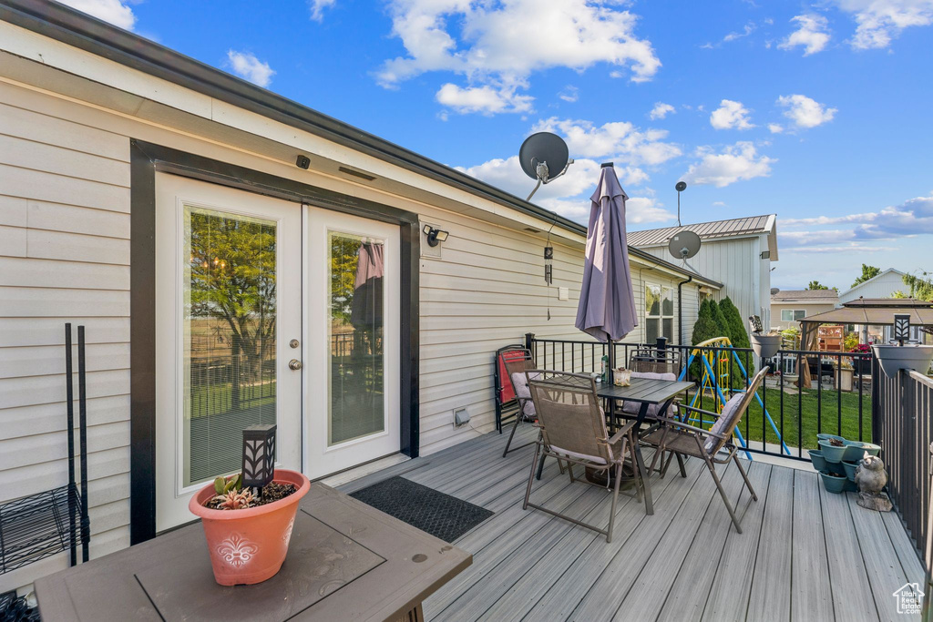 Deck with outdoor dining area and french doors