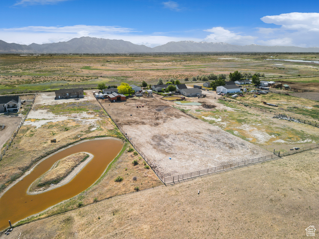 Aerial view of sparsely populated area featuring a mountainous background