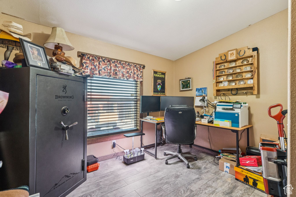 Home office with wood finished floors