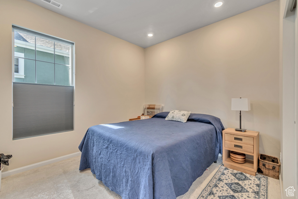 Carpeted bedroom featuring baseboards and recessed lighting