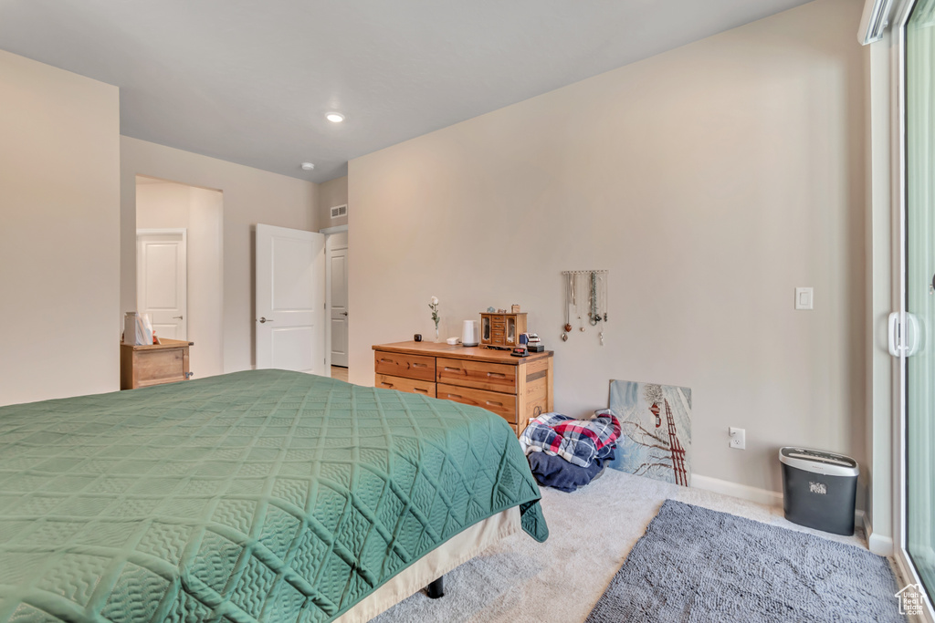 Carpeted bedroom featuring baseboards and recessed lighting