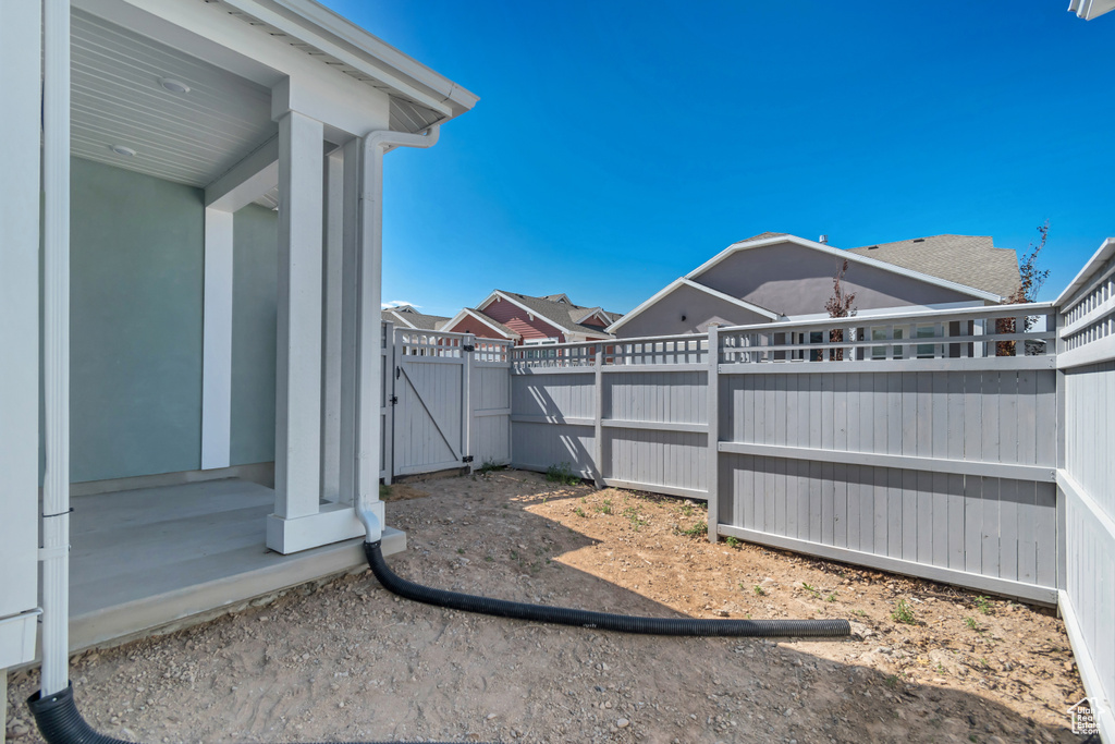 View of yard featuring a gate