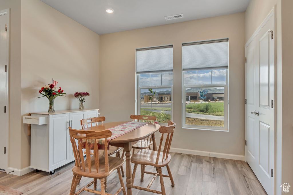 Dining space featuring light wood-type flooring, recessed lighting, and baseboards