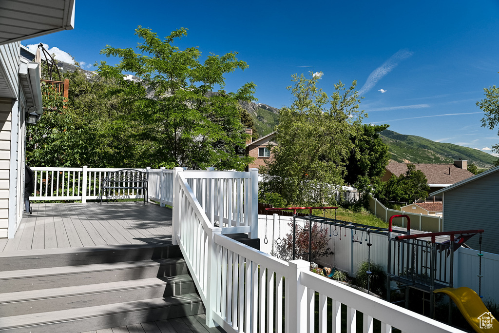 Wooden terrace featuring a mountain view