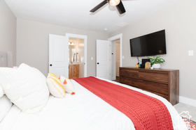 Bedroom with baseboards and a ceiling fan