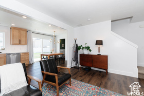 Living room featuring wood finished floors, baseboards, and recessed lighting