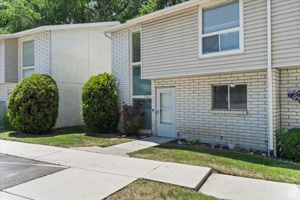 Townhome / multi-family property with brick siding
