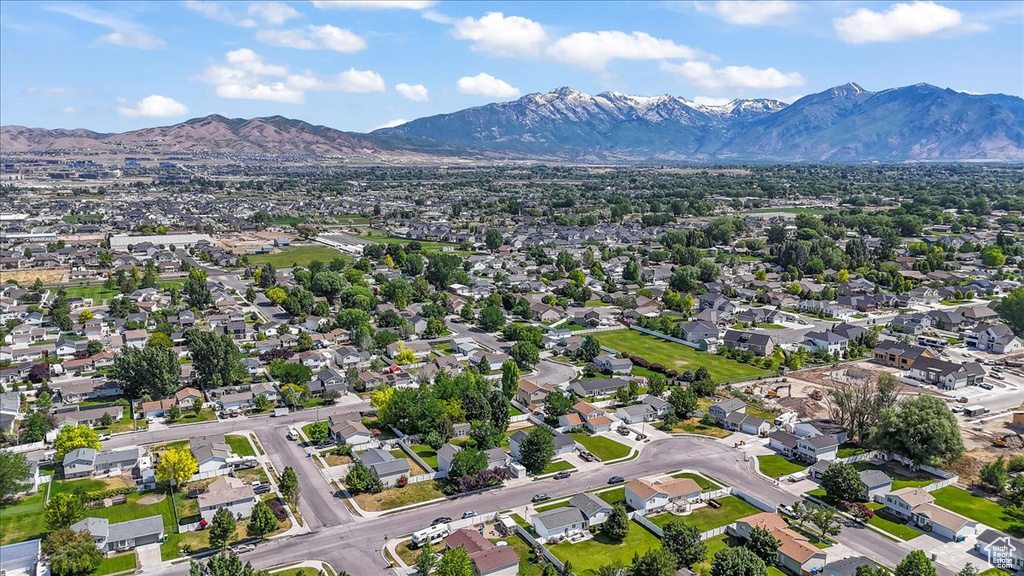 View of property location featuring mountains and nearby suburban area