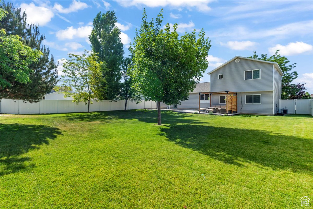 View of yard with a patio