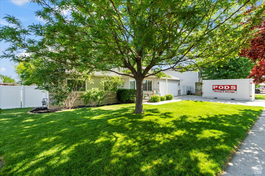 View of yard with a garage