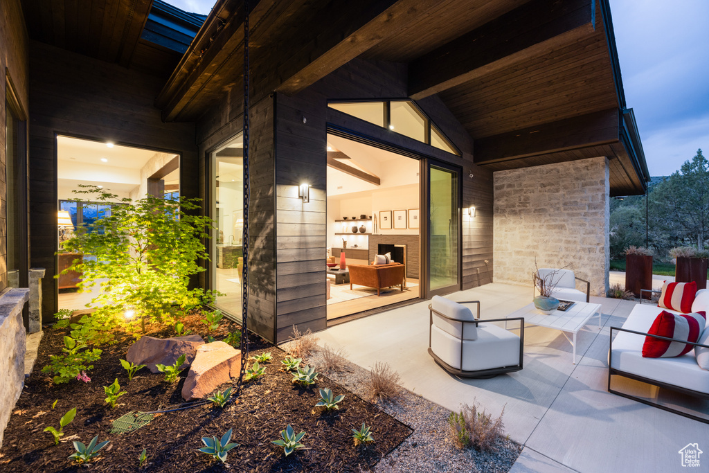 View of patio with an outdoor hangout area