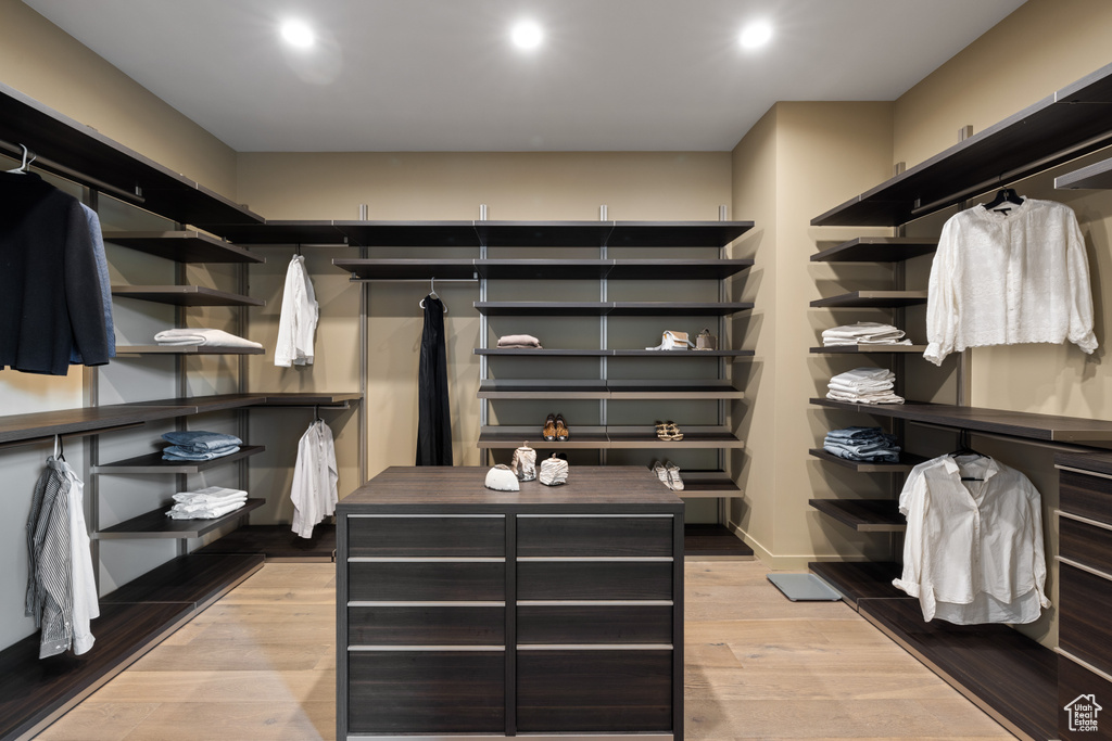 Spacious closet with light wood-style floors