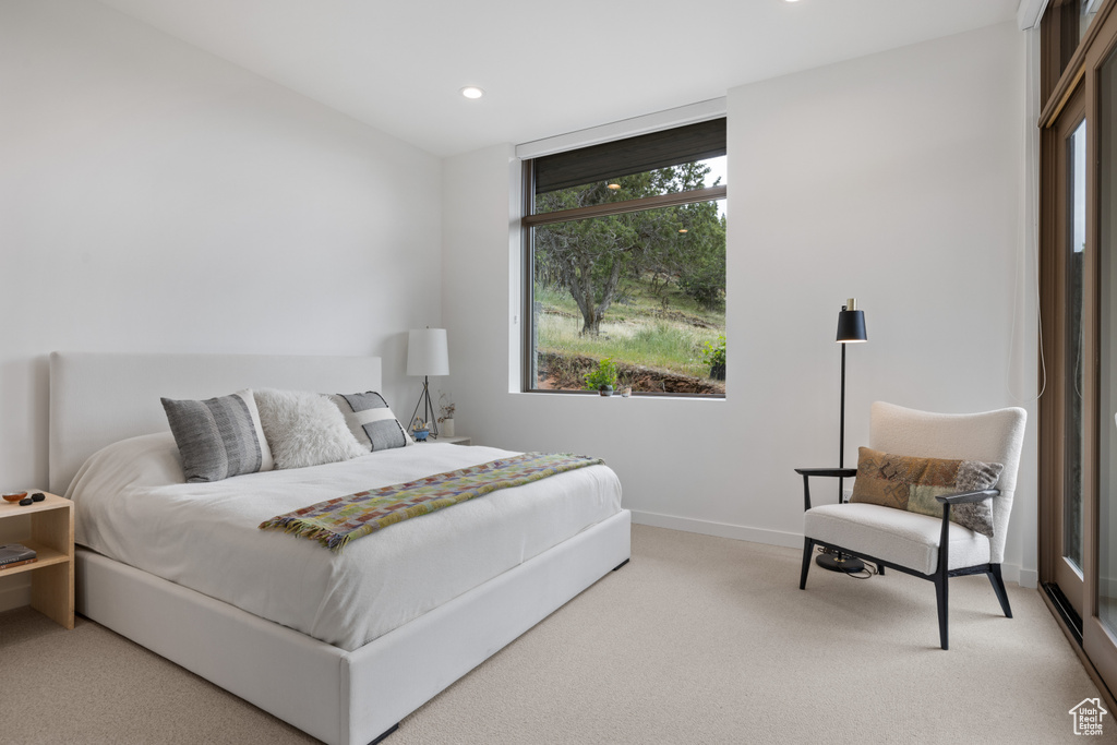 Carpeted bedroom with recessed lighting and baseboards