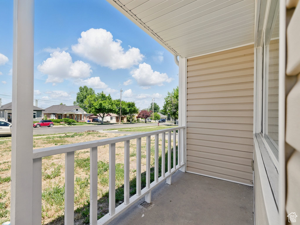 Covered porch with a residential view